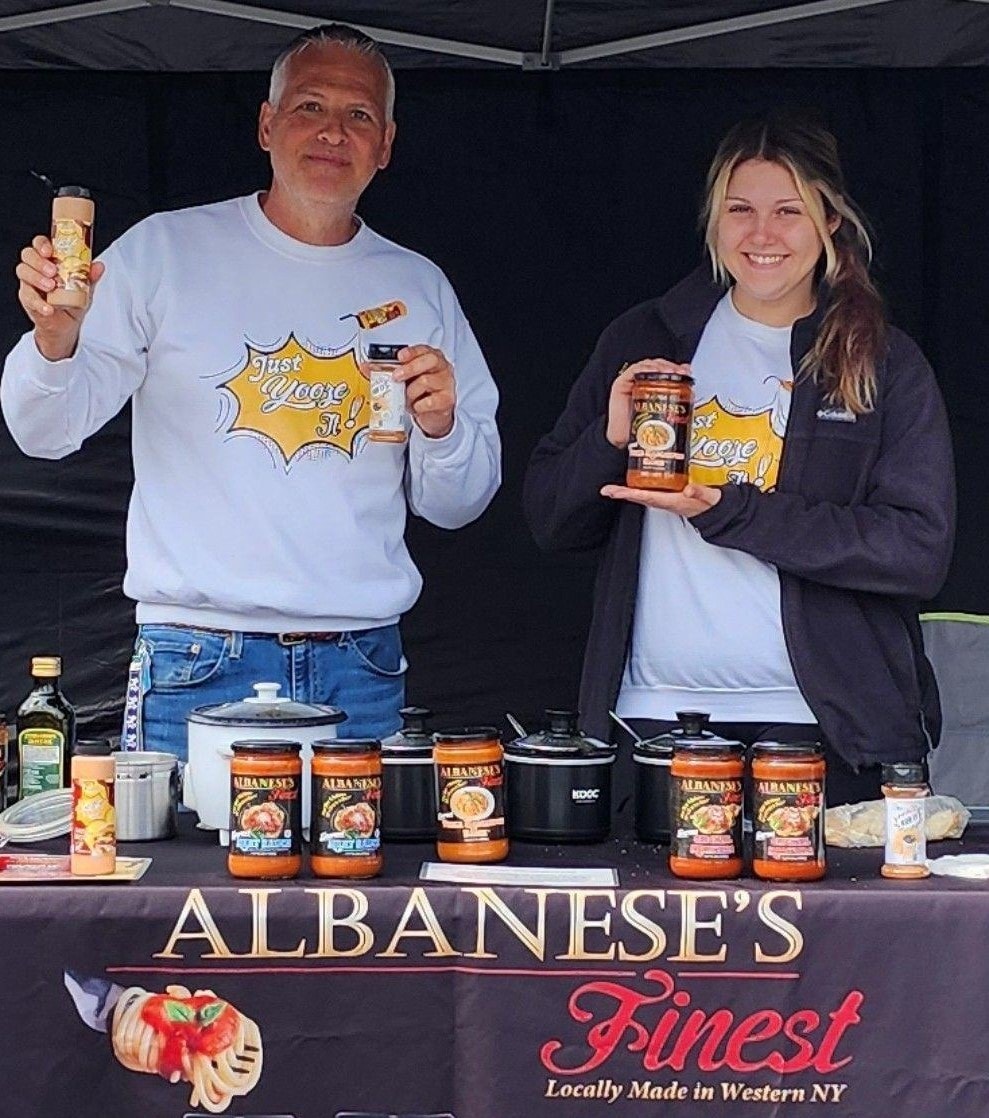 Darrin and Kaleigh Albanese at a tasting event with Albanese's Finest sauces
